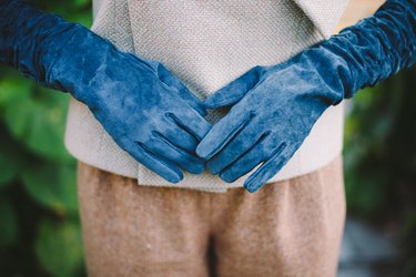 Hands in suede gloves