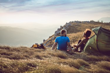 Young Couple Camping on Top of Hill