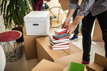 Pile of books on cardboard box