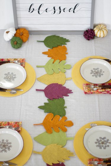 This colorful DIY felt fall leaves table runner is easy to make, will brighten up your fall table and make all your meals feel special.