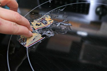 how to clean melted plastic off a stovetop burner