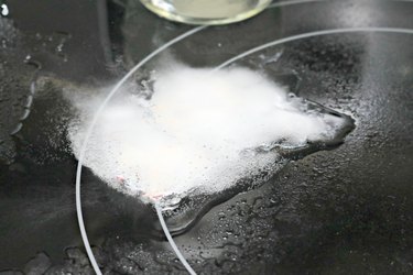 how to clean melted plastic off a stovetop burner