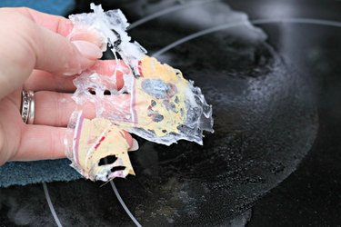 how to clean melted plastic off a stovetop burner