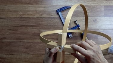 Assembling DIY orb pendant light using embroidery or quilting hoops