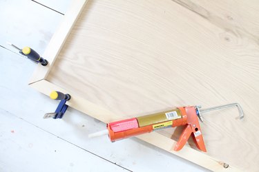 Glue framing pieces to headboard