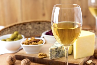 White Wine and cheese arrangement on the table