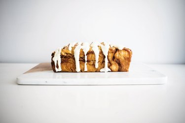 Pull-apart bread drizzled with cream cheese glaze.