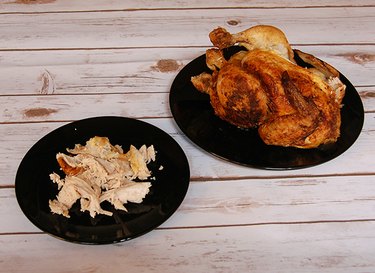 Rotisserie chicken with plate of shredded chicken