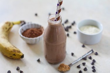 A bottle filled with a creamy protein shake.