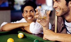 A pool table and a fully stocked bar are important elements of a classic man cave.