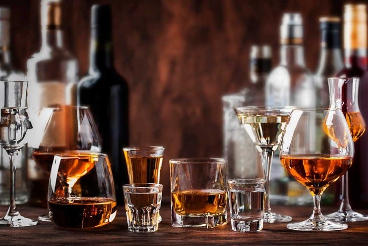 Strong Spirits Set. Hard alcoholic drinks in glasses in assortment: vodka, cognac, tequila, brandy and whiskey, grappa, liqueur, vermouth, tincture, rum.