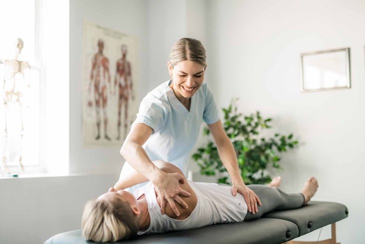 A Modern rehabilitation physiotherapy worker with woman client