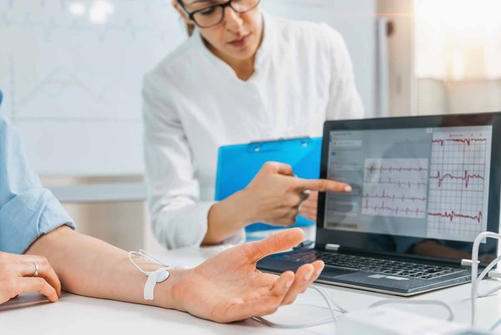 Biofeedback - female hand with attached sensors for heart rate measurement. Biofeedback is a complementary health improvement technique used in some health centers.